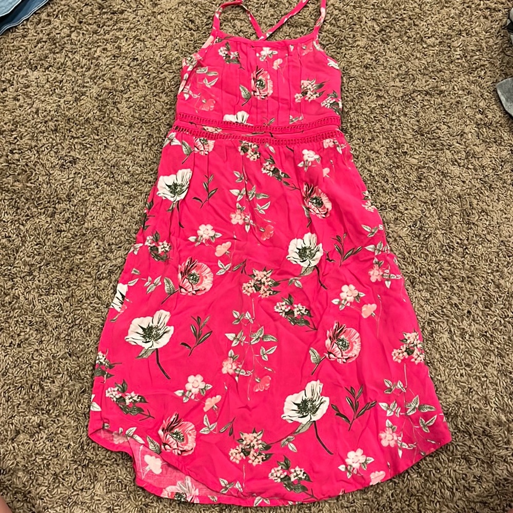 sun dress with a floral pattern and sinched back
